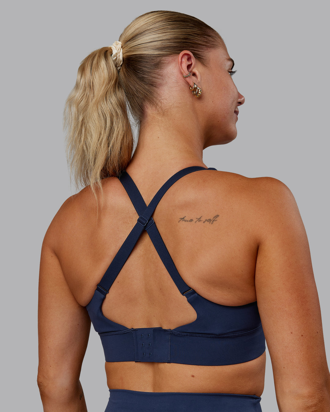 Woman wearing Accelerate Sports Bra - Future Navy | Model:Hannah | Size:S