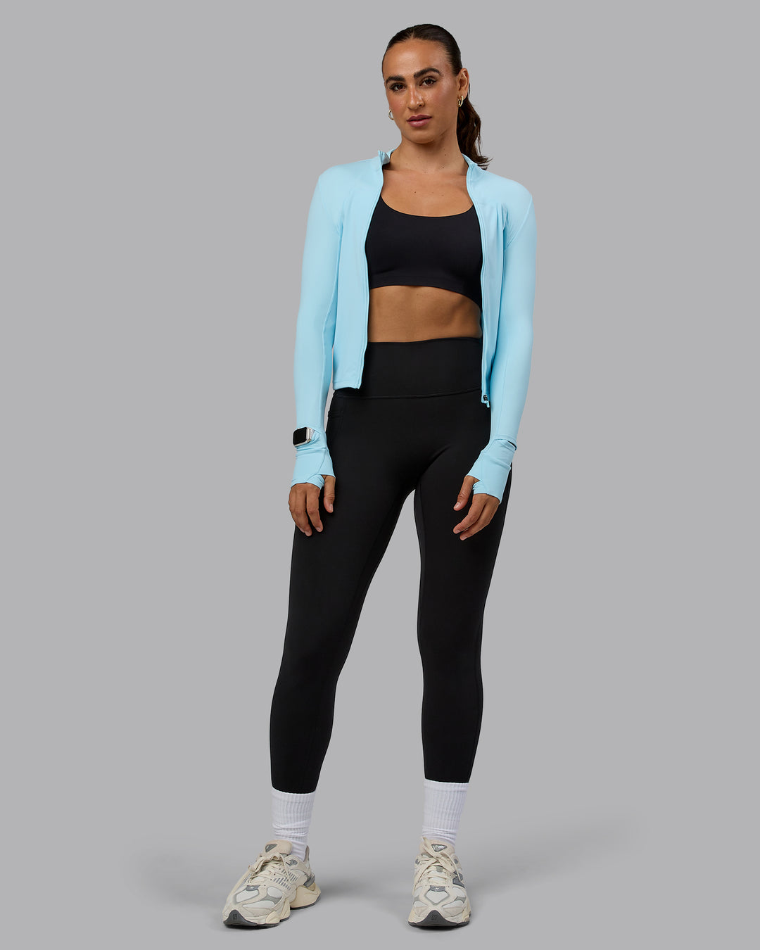 Woman wearing Aspire Jacket - Crystal Blue