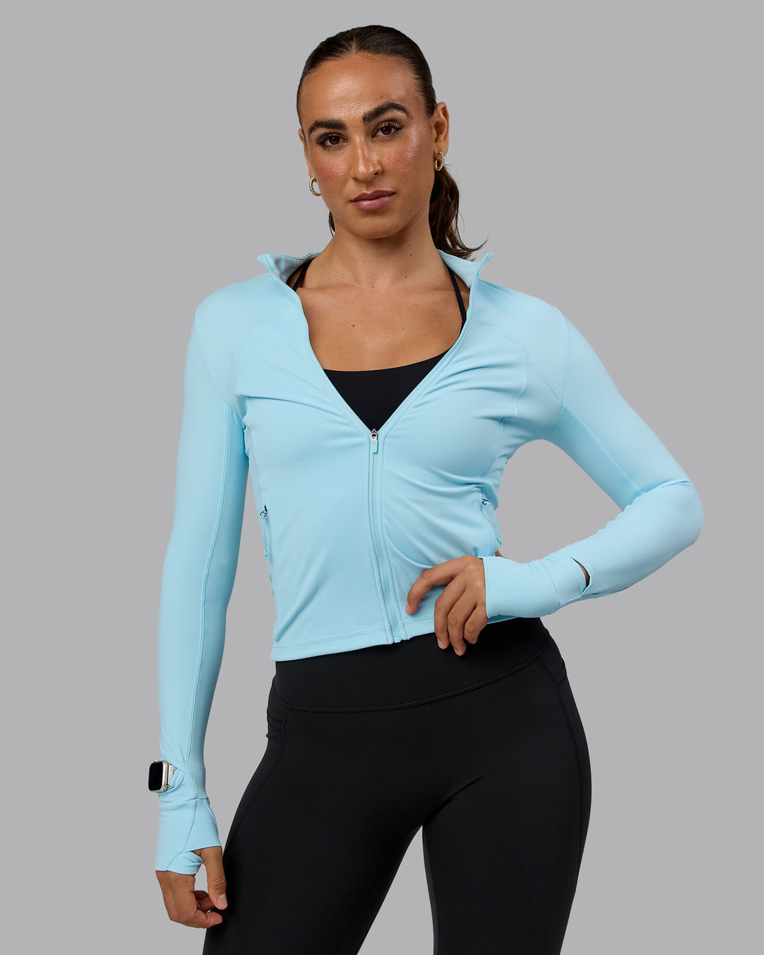 Woman wearing Aspire Jacket - Crystal Blue