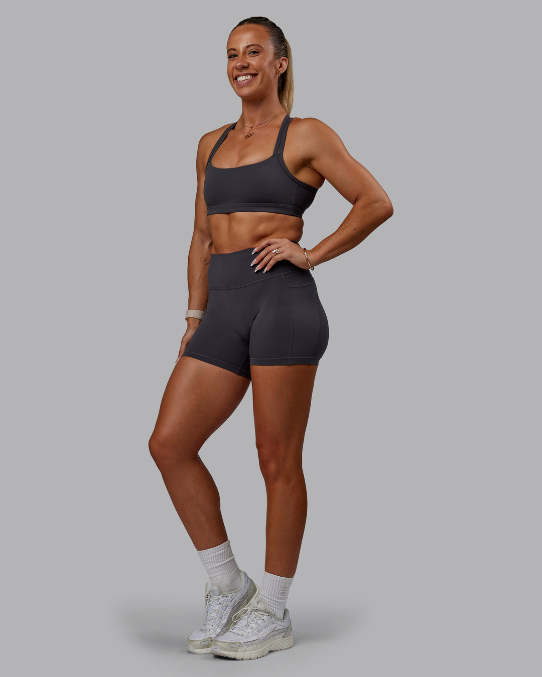 Woman wearing Bree Masters Fusion Ultra High-Rise 4" Short Pockets - Stormy