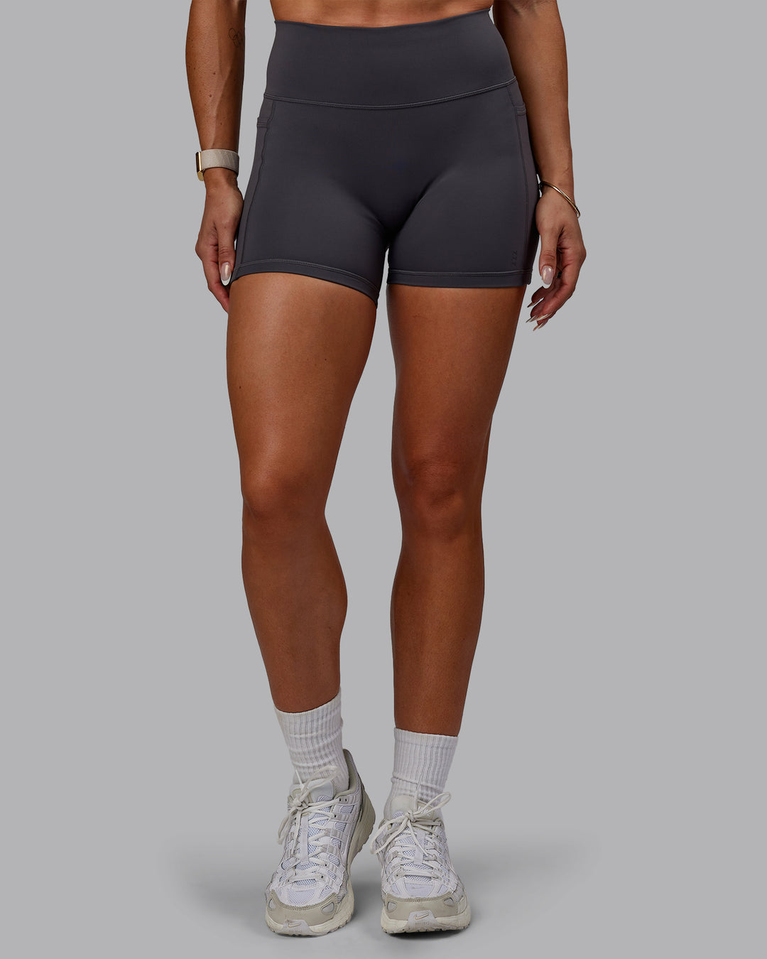 Woman wearing Bree Masters Fusion Ultra High-Rise 4" Short Pockets - Stormy