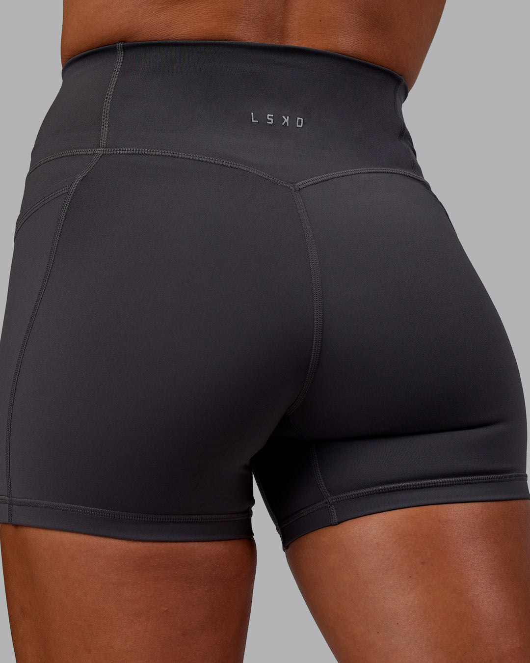 Woman wearing Bree Masters Fusion Ultra High-Rise 4" Short Pockets - Stormy