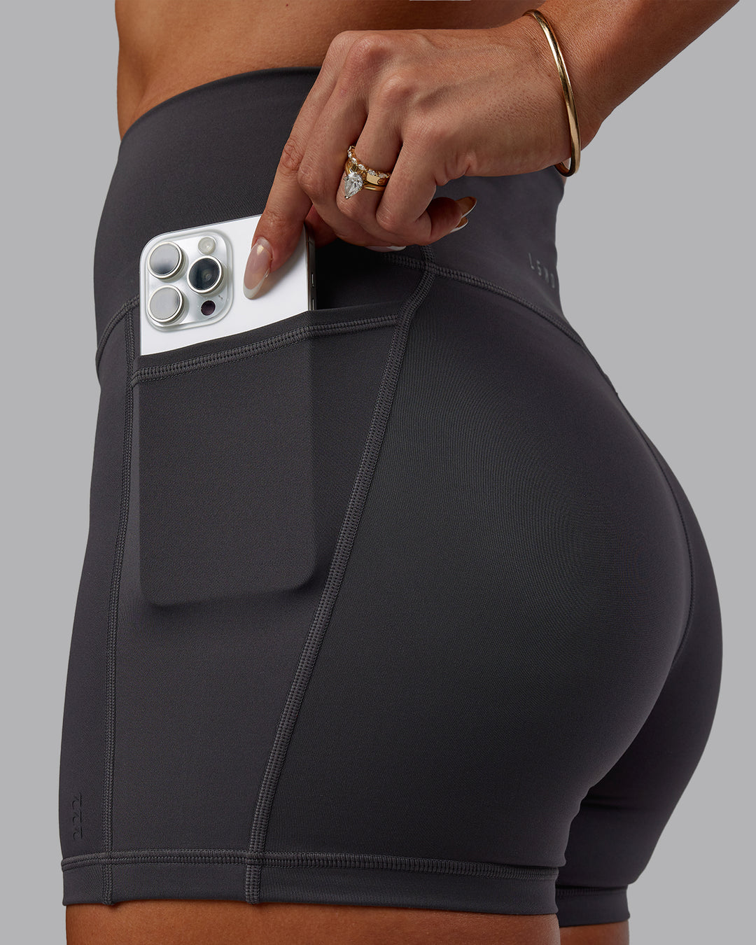Woman wearing Bree Masters Fusion Ultra High-Rise 4" Short Pockets - Stormy
