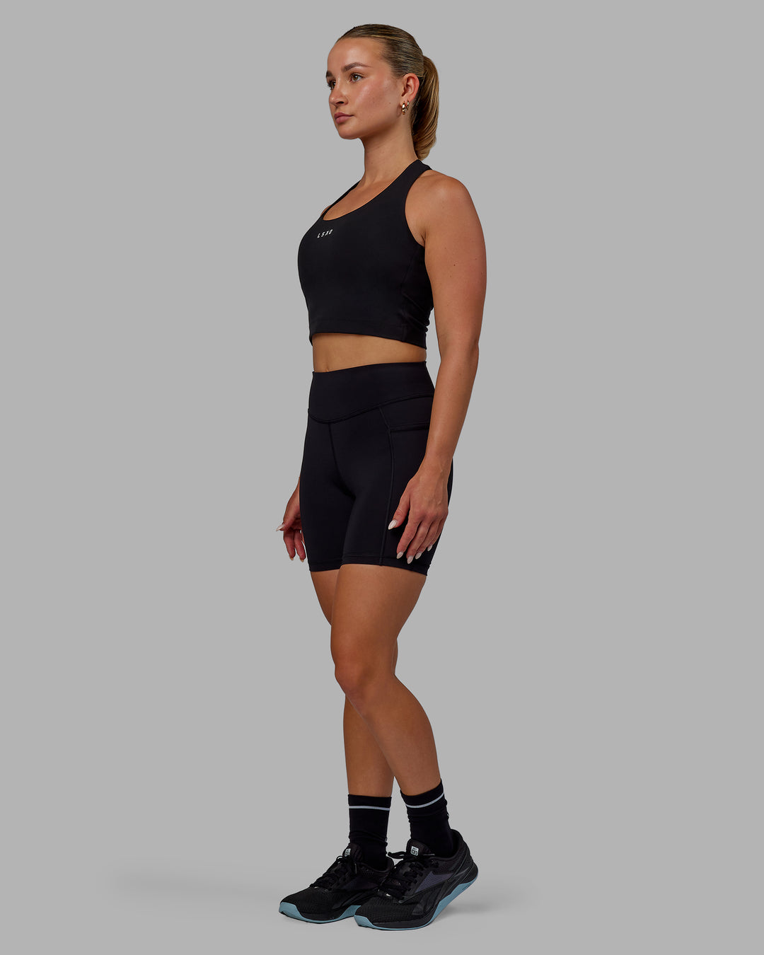 Woman wearing Elite High-Rise 6" Short Pockets - Black