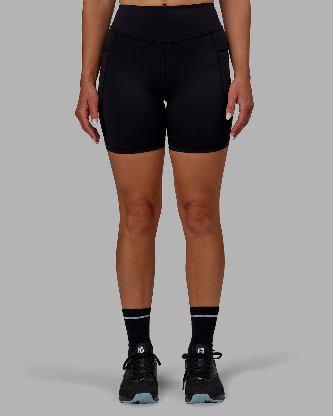 Woman wearing Elite High-Rise 6" Short Pockets - Black