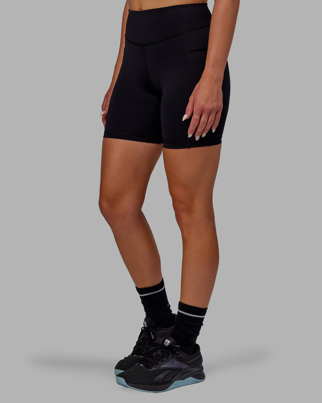 Woman wearing Elite High-Rise 6" Short Pockets - Black