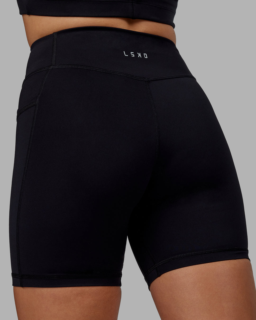 Woman wearing Elite High-Rise 6" Short Pockets - Black