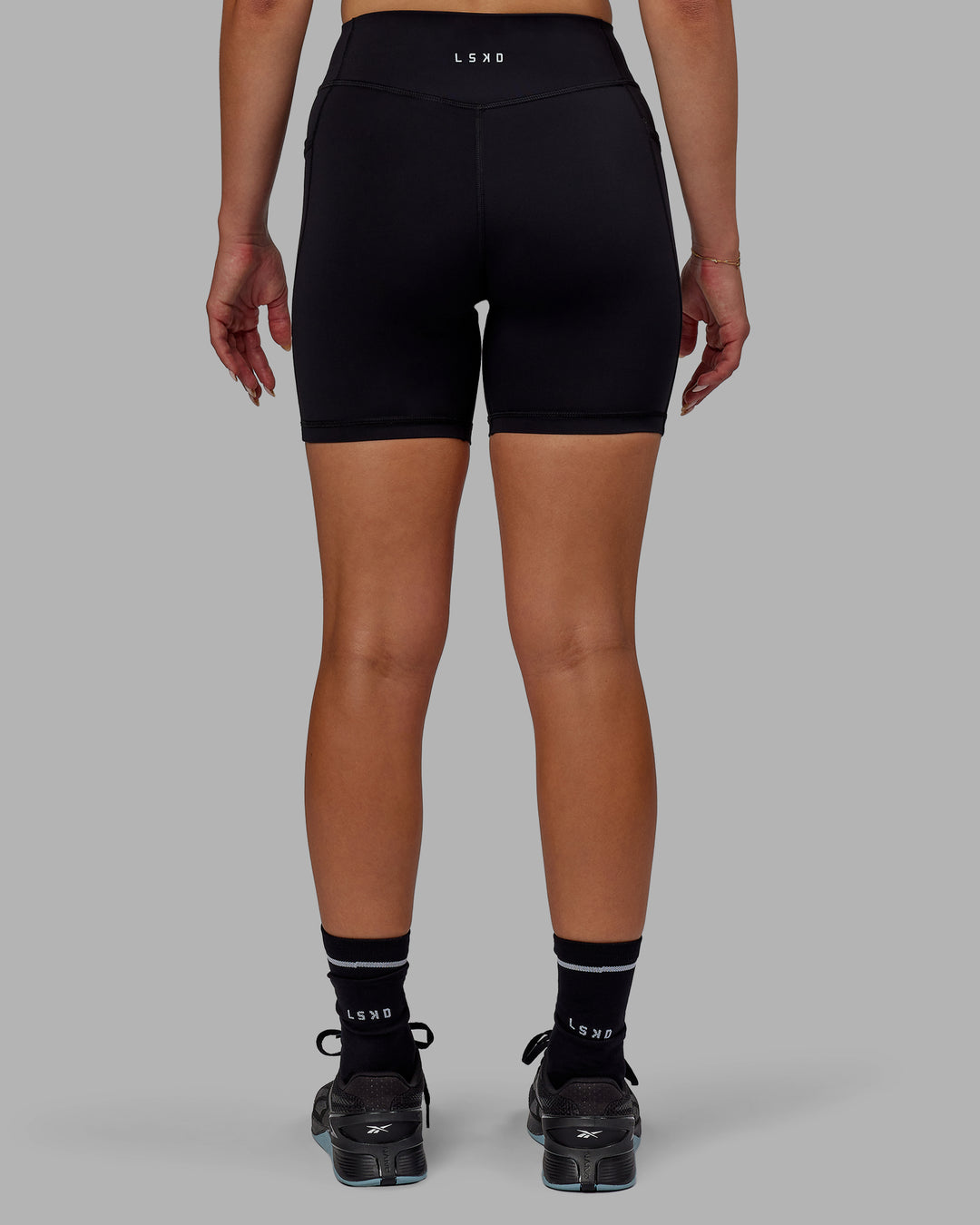 Woman wearing Elite High-Rise 6" Short Pockets - Black