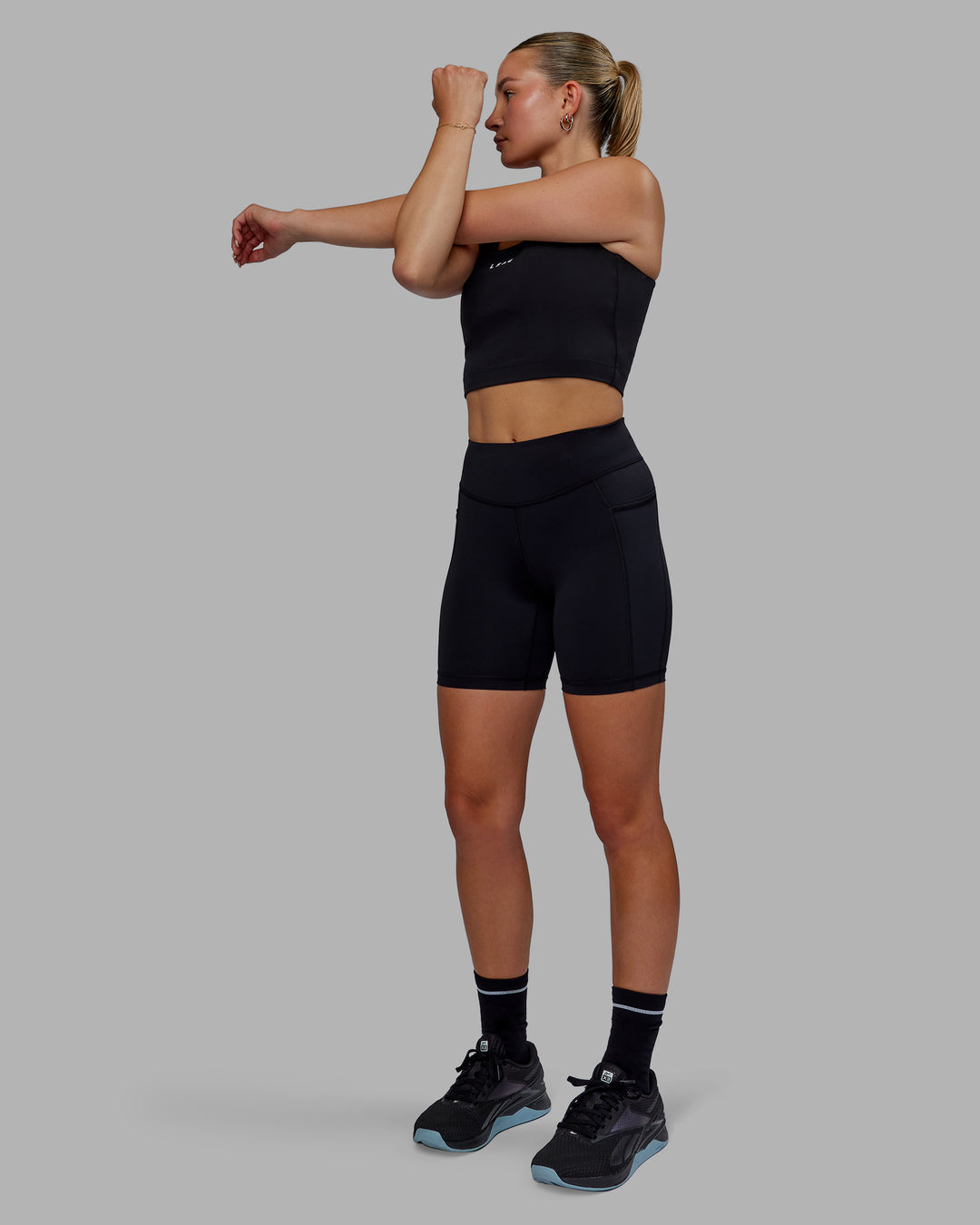 Woman wearing Elite High-Rise 6" Short Pockets - Black