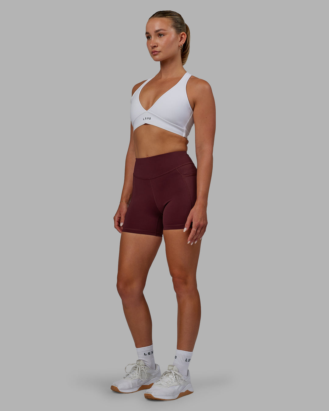 Woman wearing Elite High-Rise 4" Short Pockets - Dark Cherry