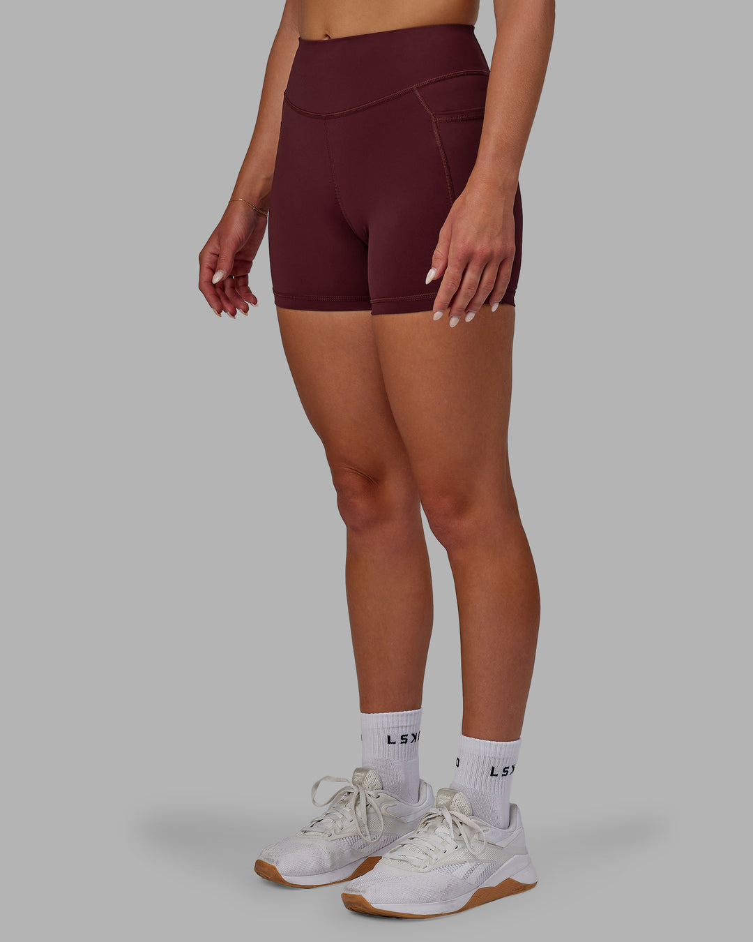 Woman wearing Elite High-Rise 4" Short Pockets - Dark Cherry