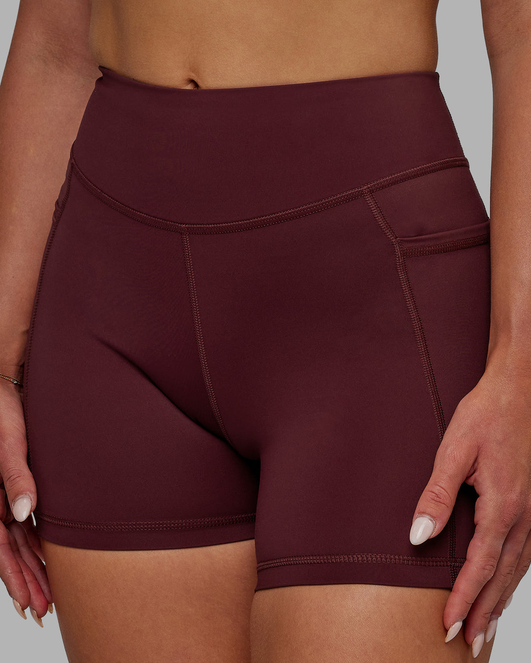 Woman wearing Elite High-Rise 4" Short Pockets - Dark Cherry