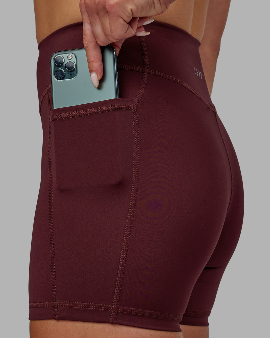 Woman wearing Elite High-Rise 4" Short Pockets - Dark Cherry
