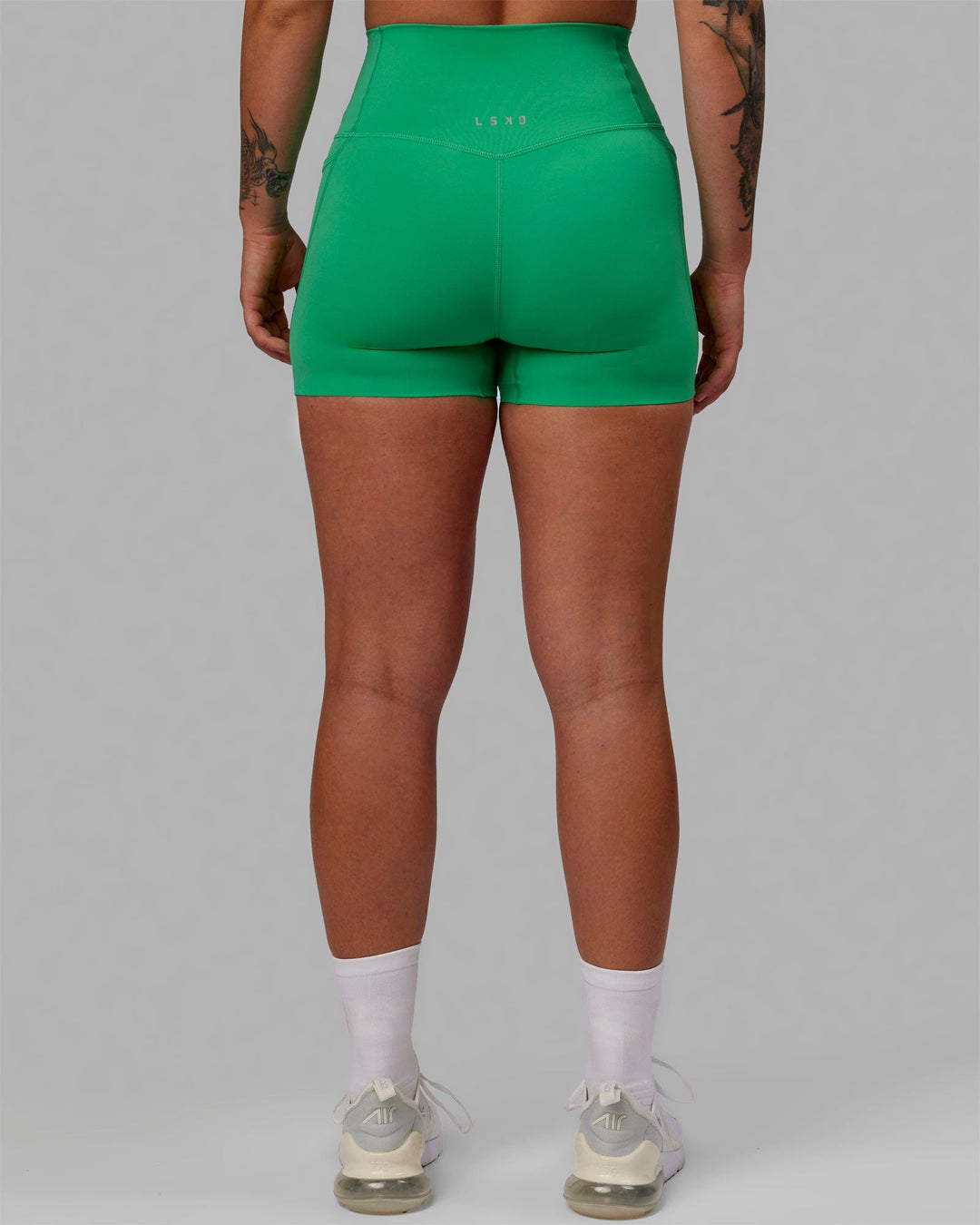 Woman wearing Elixir X-Short Tights With Pockets - Holly Green