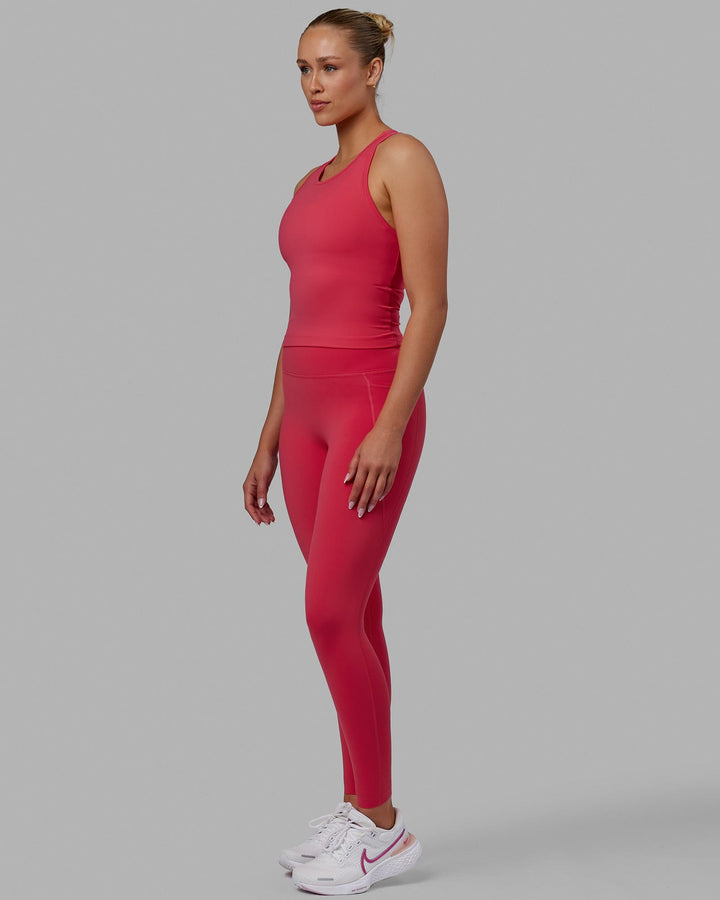 Woman wearing Flow Performance Tank - Raspberry