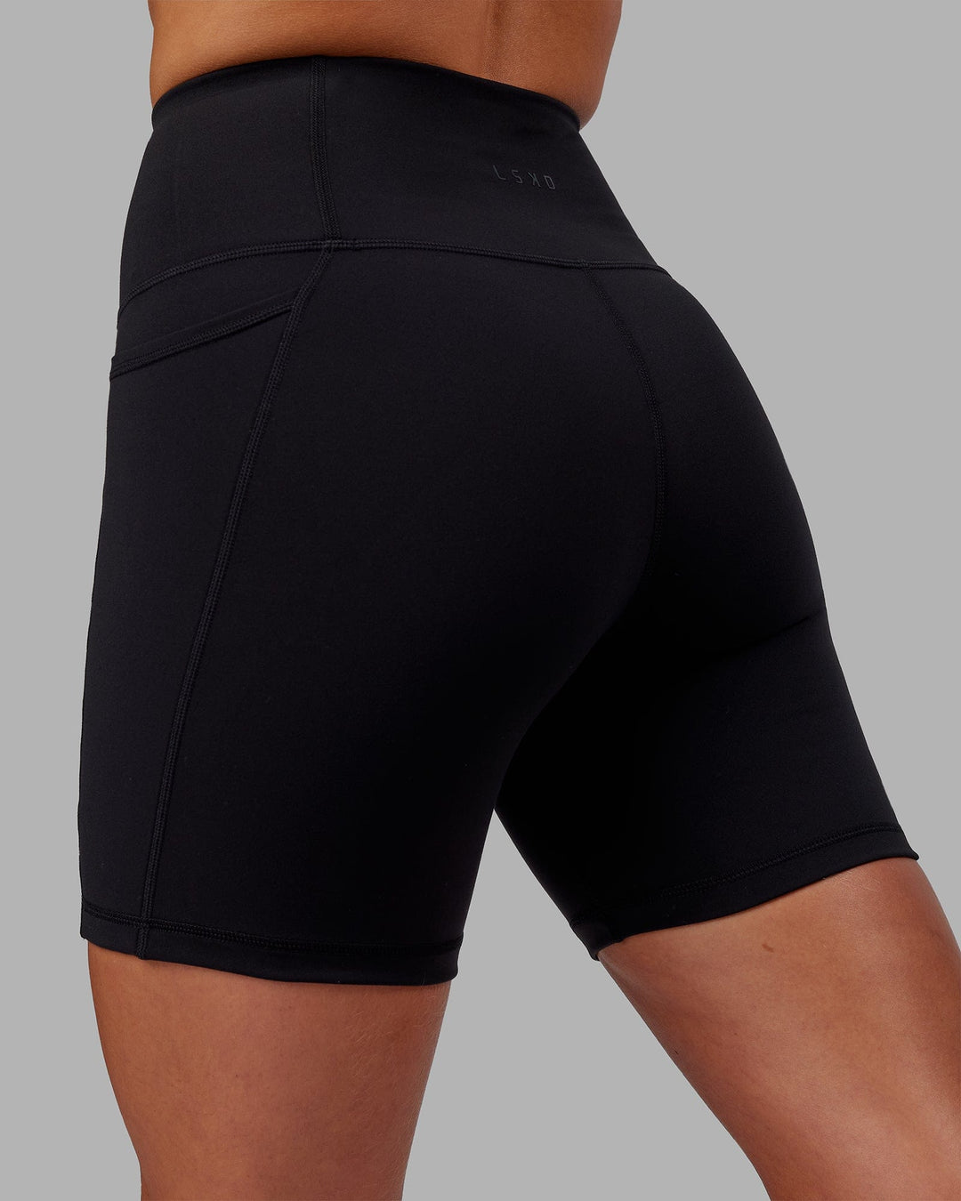 Woman wearing Flux Ultra High-Rise 6" Short Pockets - Black