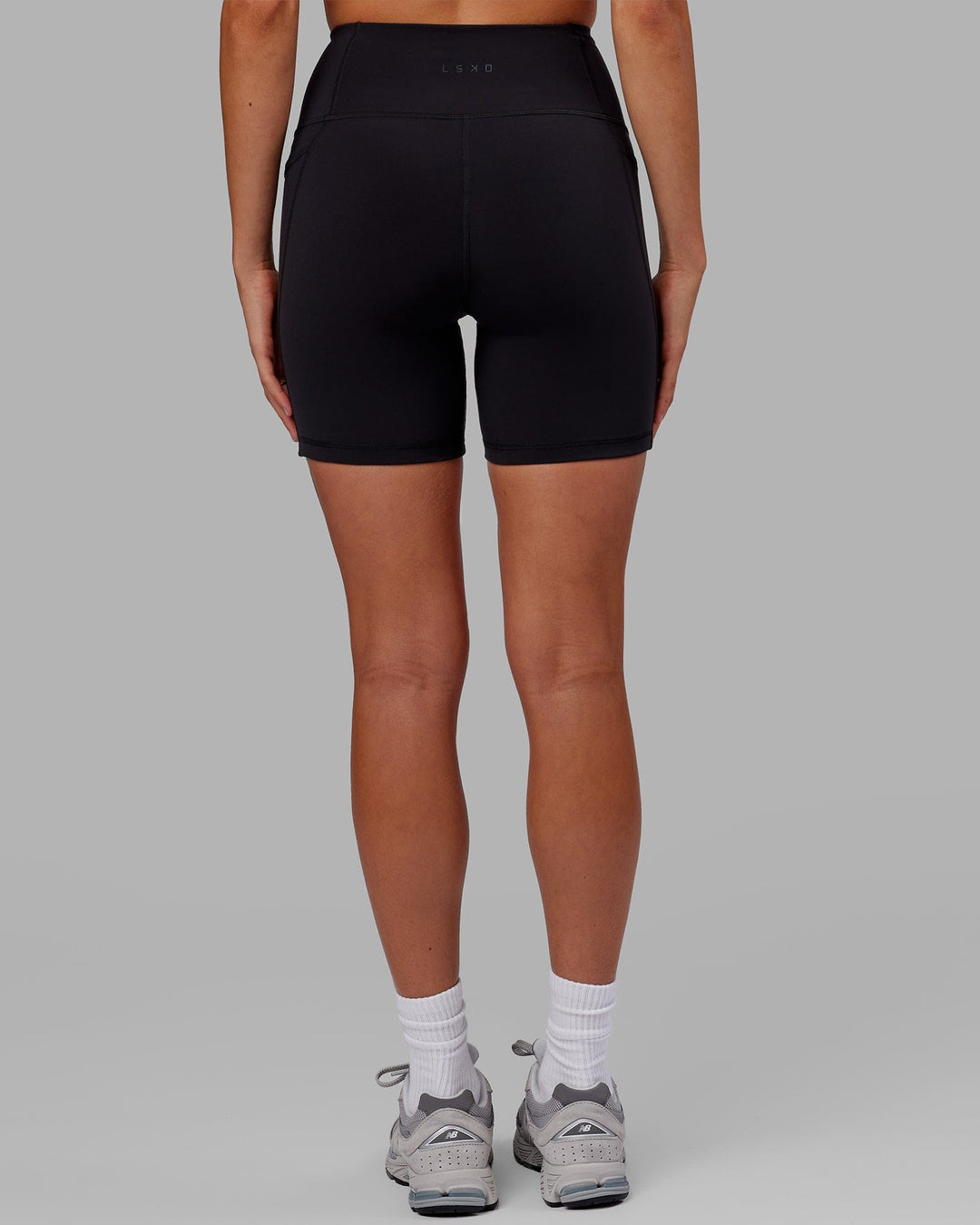 Woman wearing Flux Ultra High-Rise 6" Short Pockets - Black