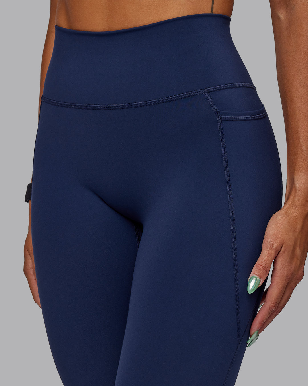 Woman wearing Fusion Ultra High-Rise 7/8 Legging Pockets - Future Navy | Model:Vanessa | Size:S
