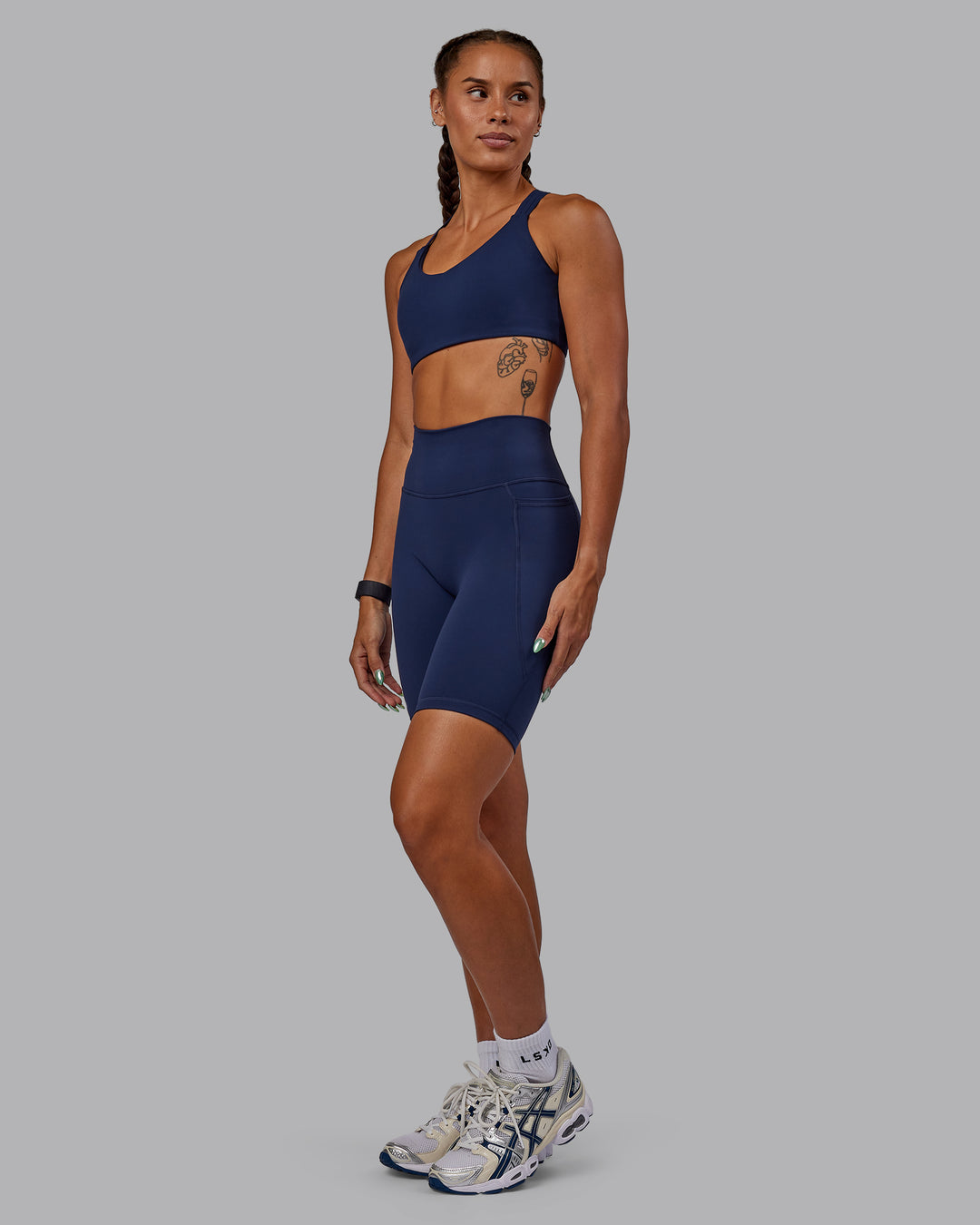 Woman wearing Fusion Ultra High-Rise 9" Short Pockets - Future Navy | Model:Vanessa | Size:S