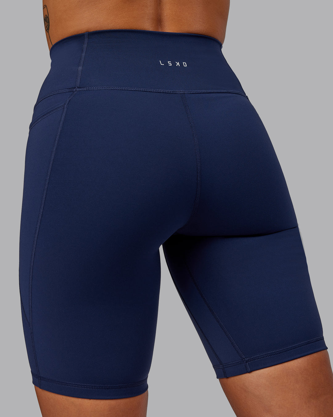 Woman wearing Fusion Ultra High-Rise 9" Short Pockets - Future Navy | Model:Vanessa | Size:S