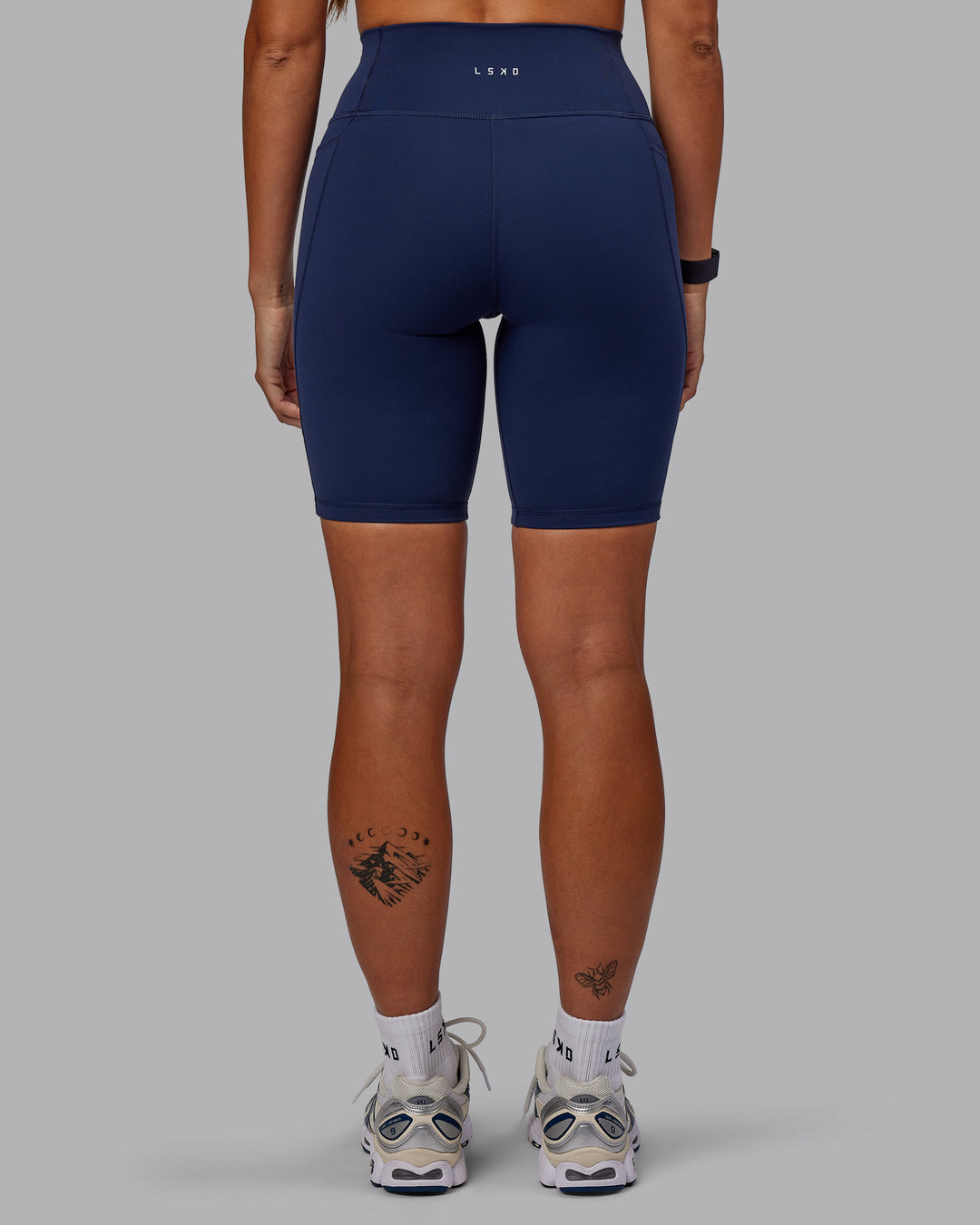 Woman wearing Fusion Ultra High-Rise 9" Short Pockets - Future Navy | Model:Vanessa | Size:S