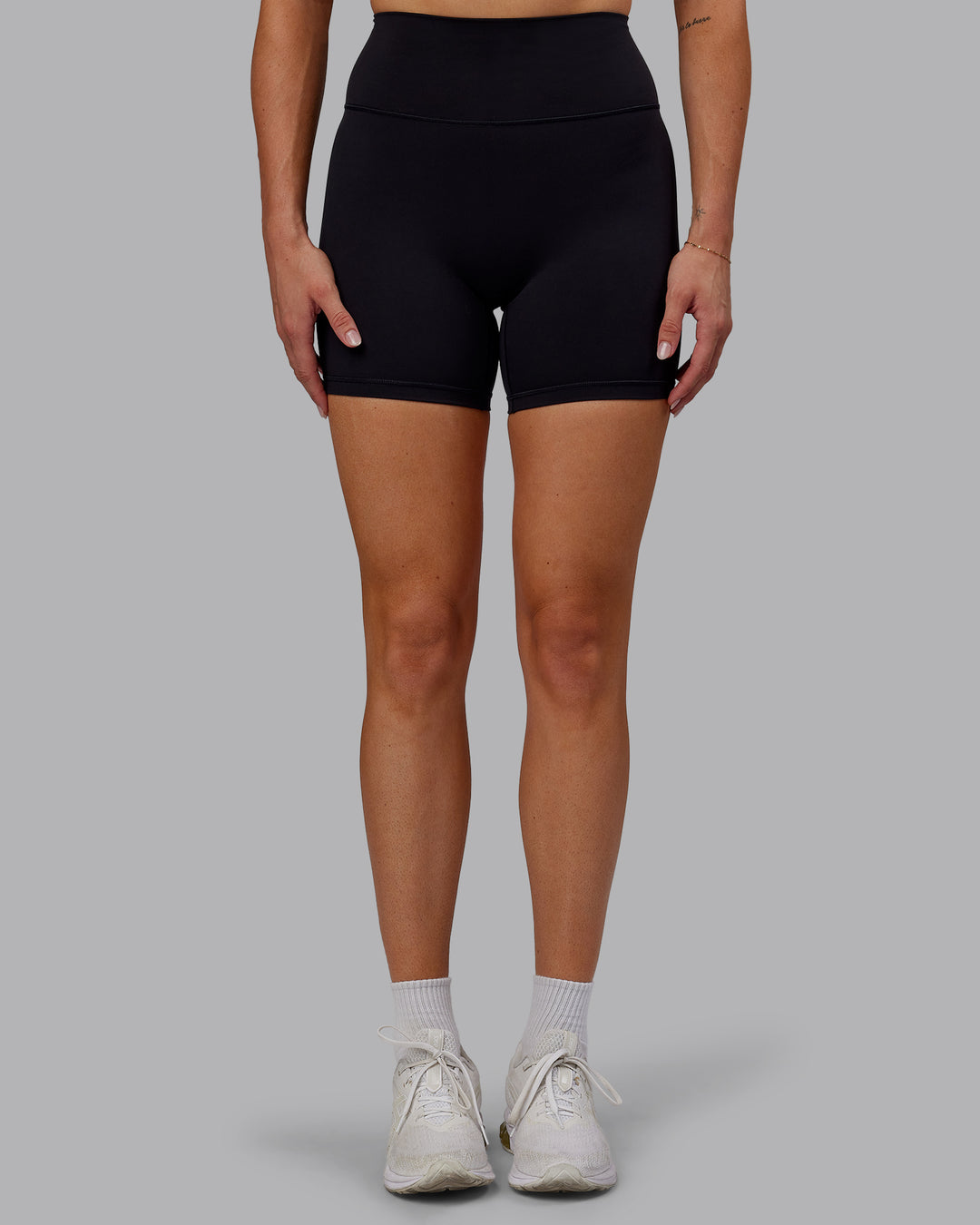 Woman wearing Fusion Ultra High-Rise 6" Short - Black | Model:Hannah | Size:S