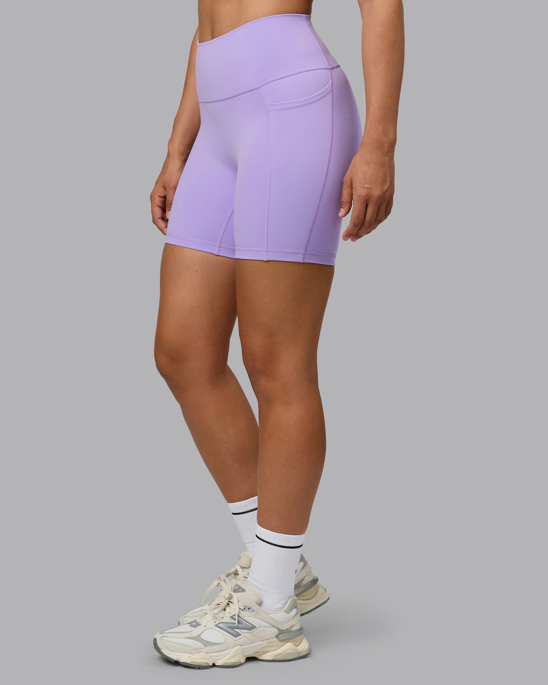 Woman wearing Fusion Ultra High-Rise 6" Short Pockets - Pale Lilac | Model:Sophie | Size:S