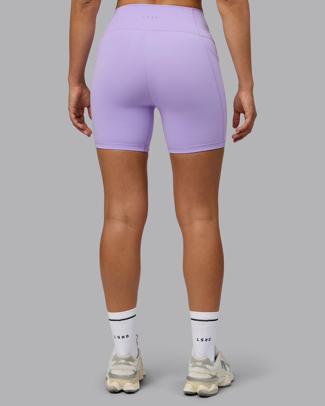 Woman wearing Fusion Ultra High-Rise 6" Short Pockets - Pale Lilac | Model:Sophie | Size:S