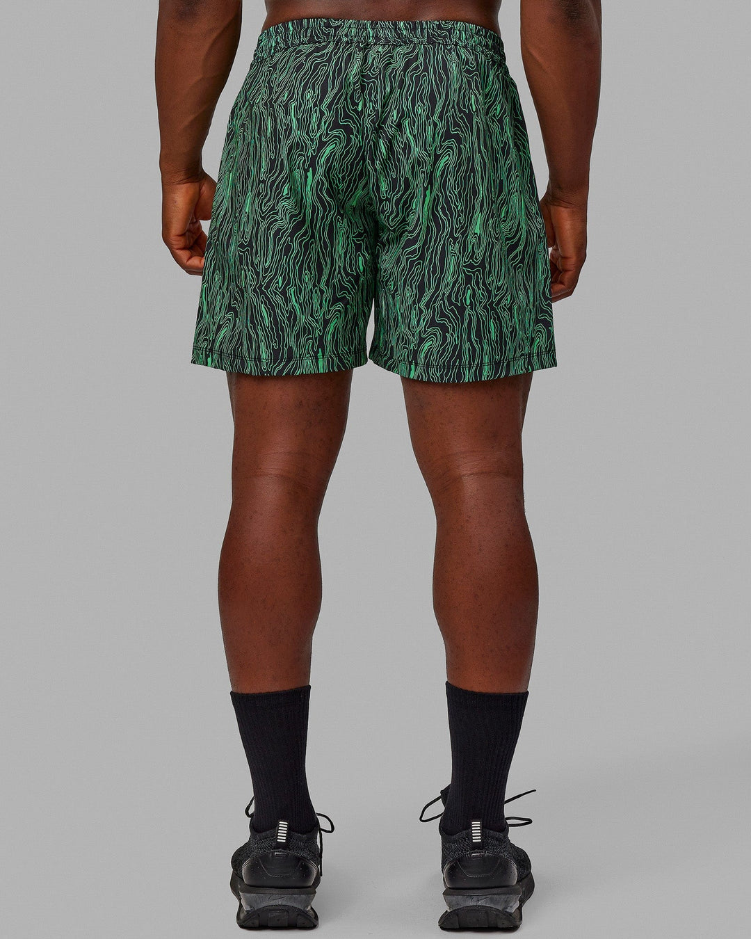 Man wearing Rep 5" Performance Shorts - Topographic Black-Lime