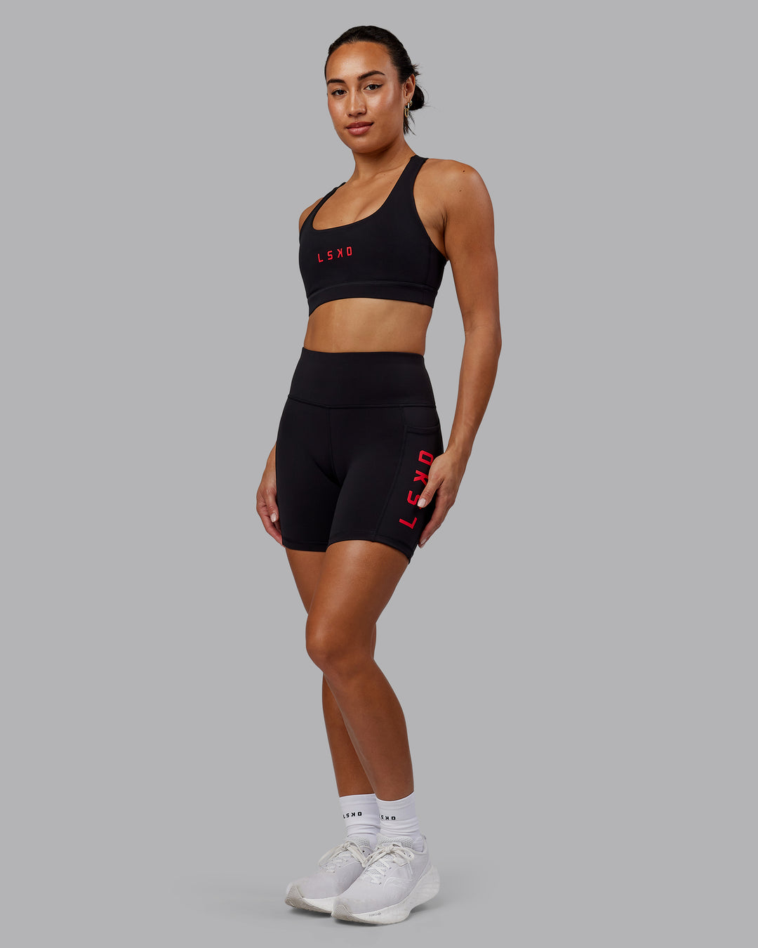 Woman wearing Rep Ultra High-Rise 6" Short Pockets - Black-Scarlet | Model:Demi | Size:S