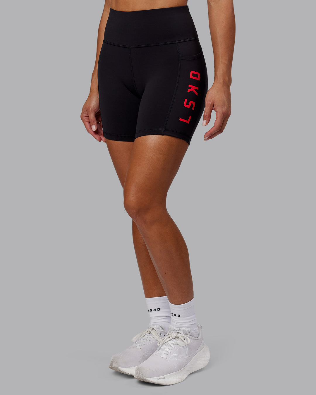 Woman wearing Rep Ultra High-Rise 6" Short Pockets - Black-Scarlet | Model:Demi | Size:S