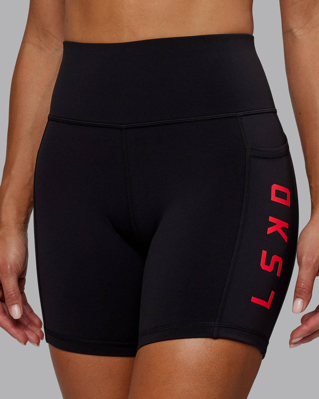 Woman wearing Rep Ultra High-Rise 6" Short Pockets - Black-Scarlet | Model:Demi | Size:S