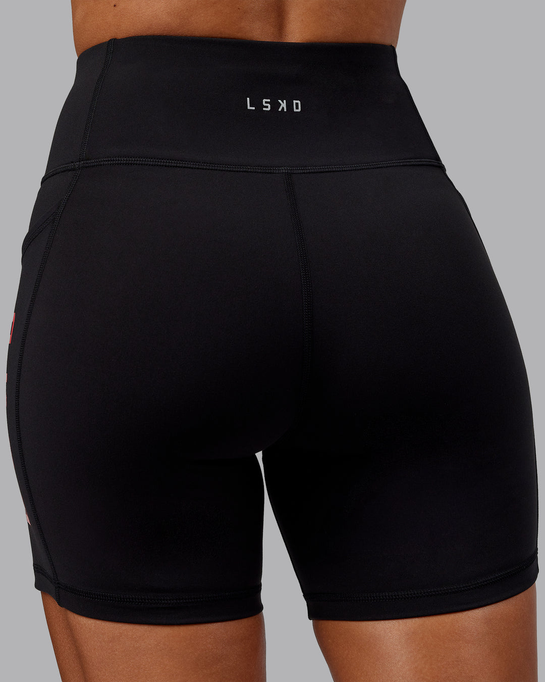 Woman wearing Rep Ultra High-Rise 6" Short Pockets - Black-Scarlet | Model:Demi | Size:S
