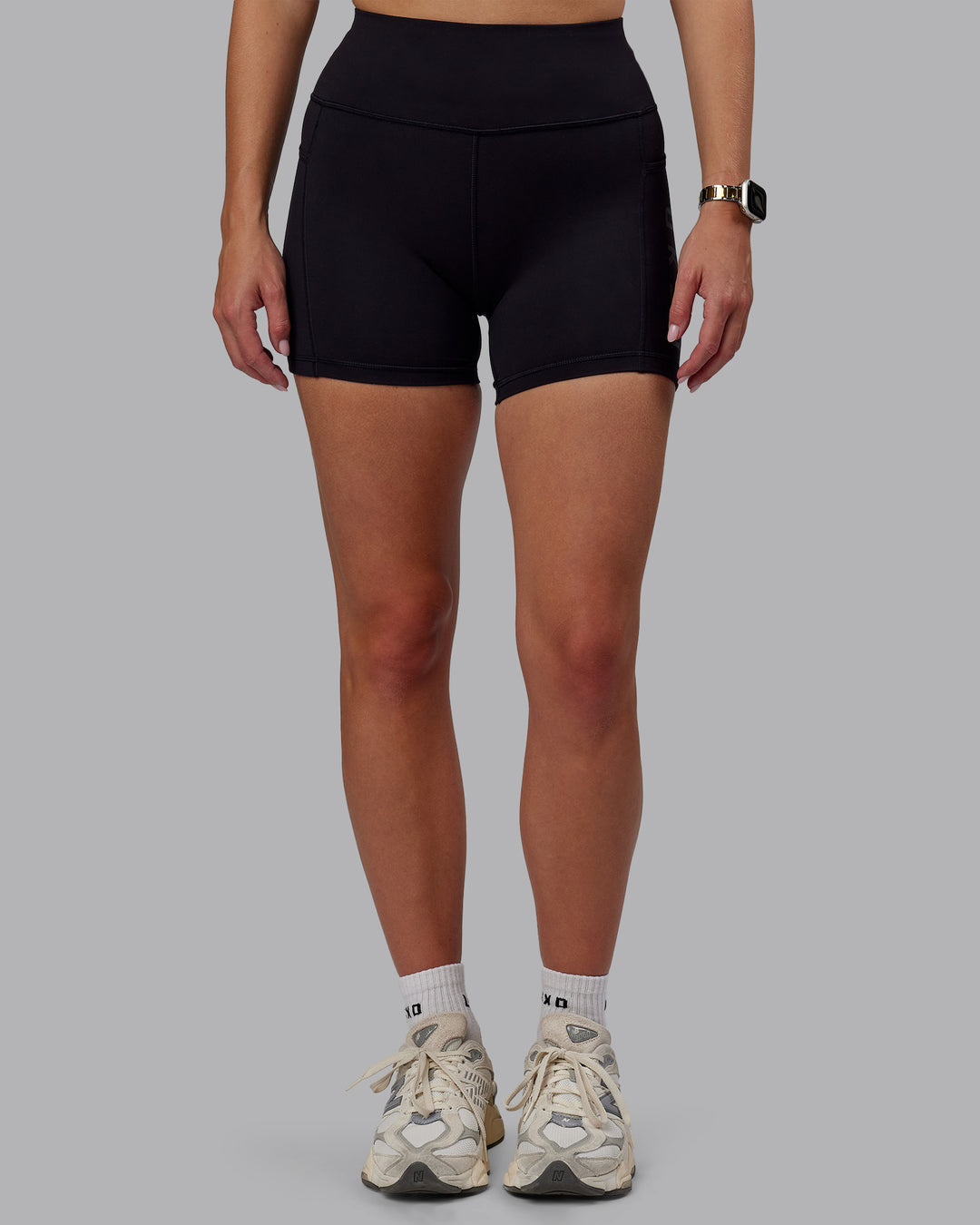 Woman wearing Rep Ultra High-Rise 4" Short Pockets - Black-Black | Model:Lillie | Size:S