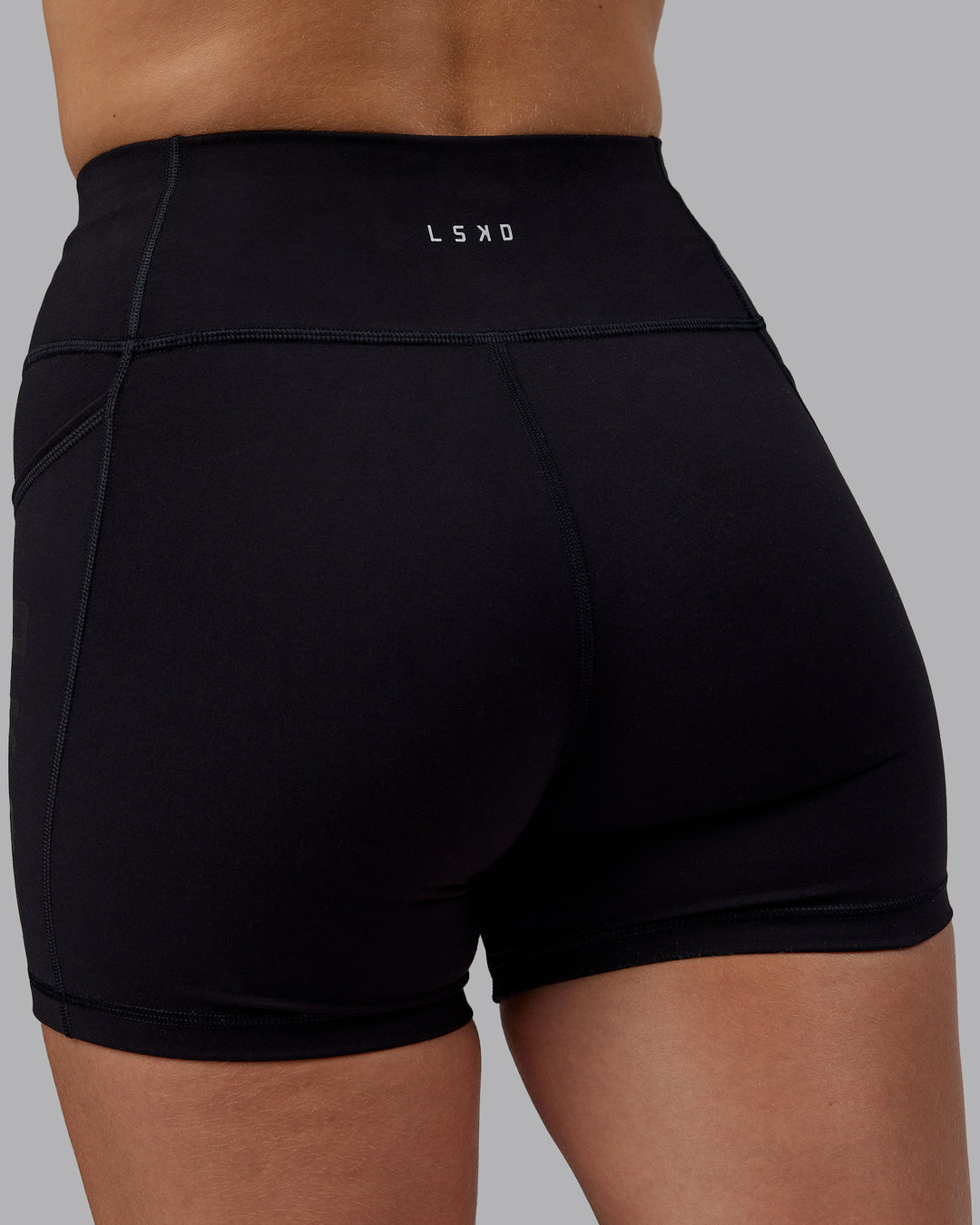 Woman wearing Rep Ultra High-Rise 4" Short Pockets - Black-Black | Model:Lillie | Size:S