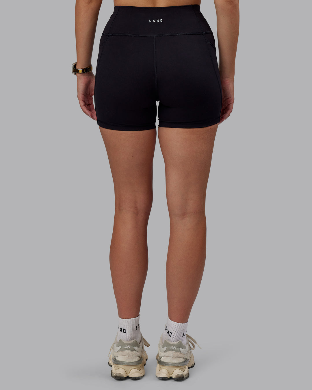 Woman wearing Rep Ultra High-Rise 4" Short Pockets - Black-Black | Model:Lillie | Size:S
