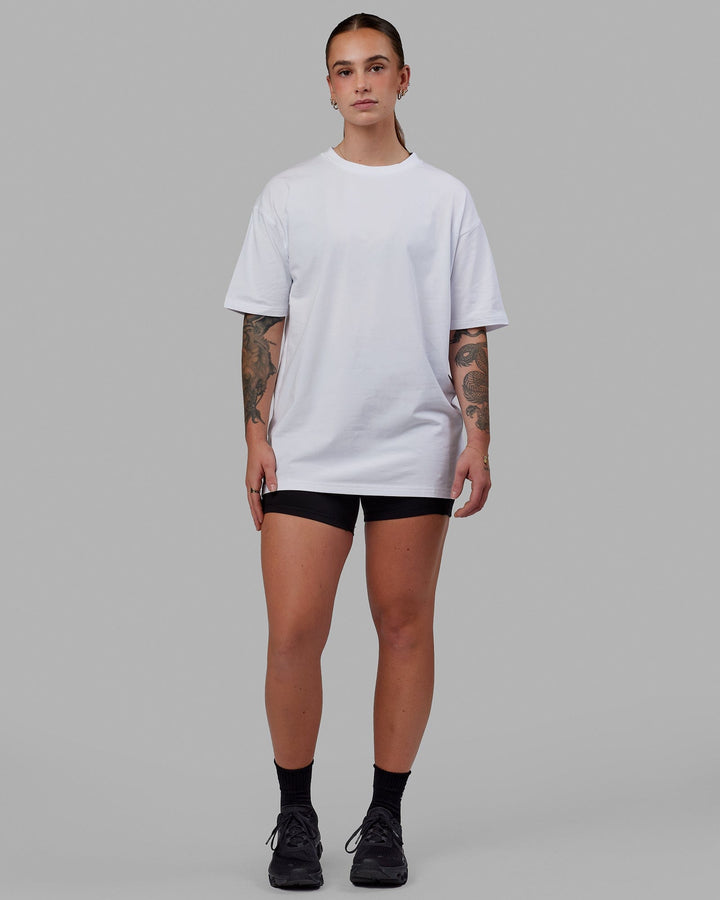 Woman wearing Unisex Love The Run FLXCotton Tee Oversize - White-Black