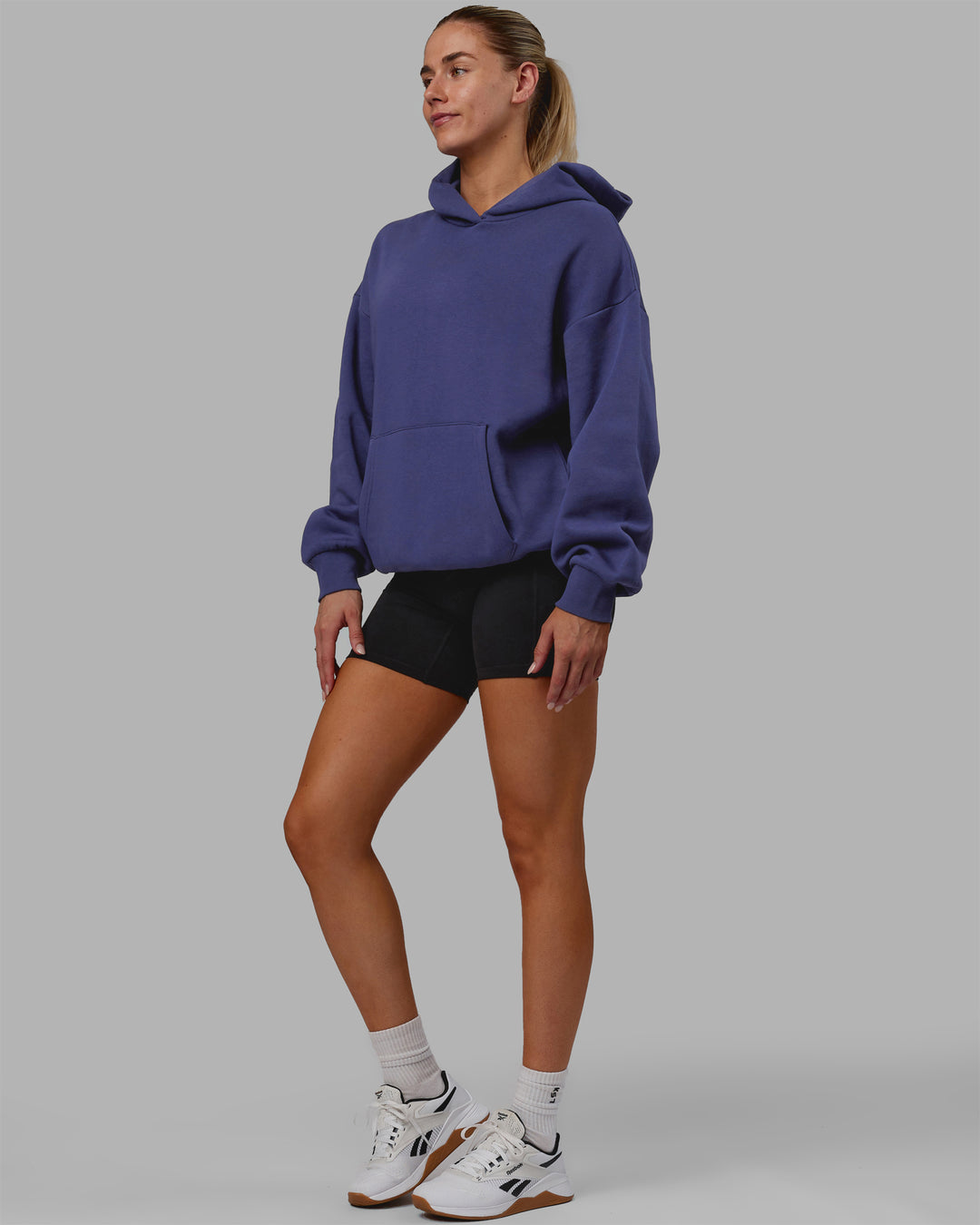 Woman wearing Unisex Love The Run Hoodie Oversize - Future Dusk-Galactic Lilac