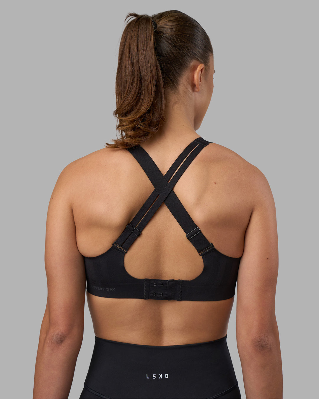 Woman wearing Stability Sports Bra - Black | Model:Charlize | Size:S (A-C Cup)