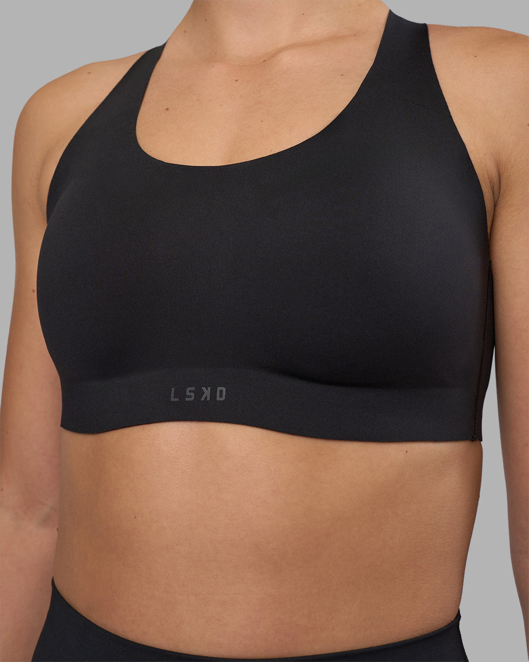 Woman wearing Stability Sports Bra - Black | Model:Charlize | Size:S (A-C Cup)