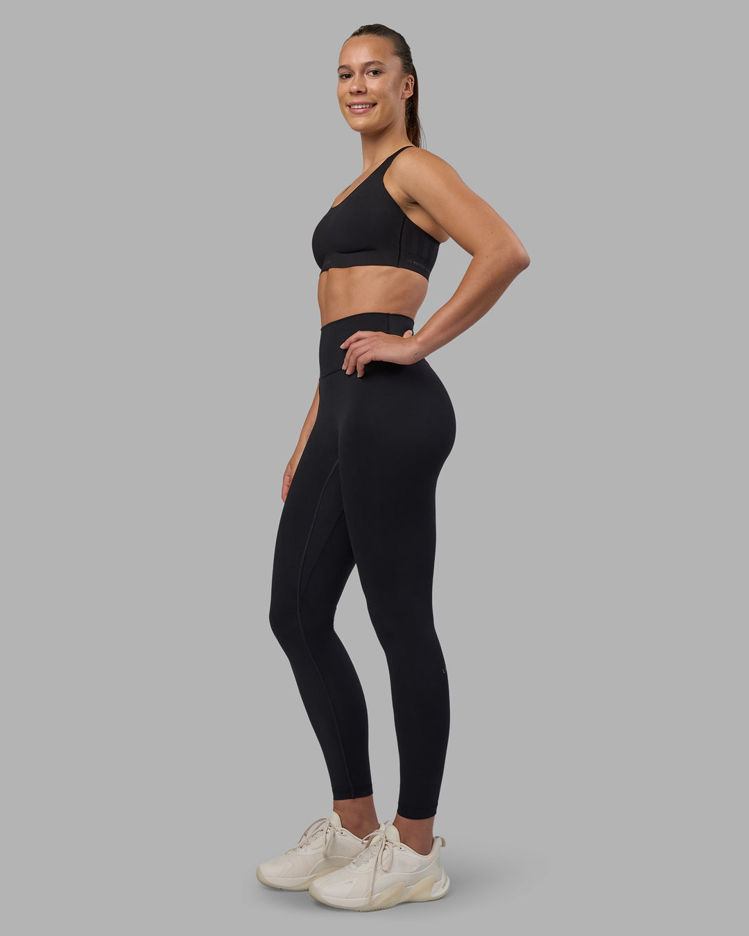 Woman wearing Stability Sports Bra - Black | Model:Charlize | Size:S (A-C Cup)