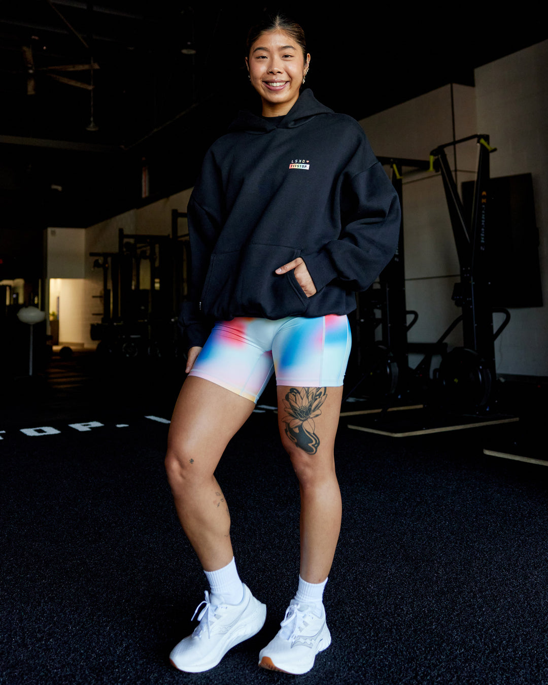 Woman wearing Fitstop Unstoppable Together Oversized Hoodie - Black | Model:Beccie | Size:S