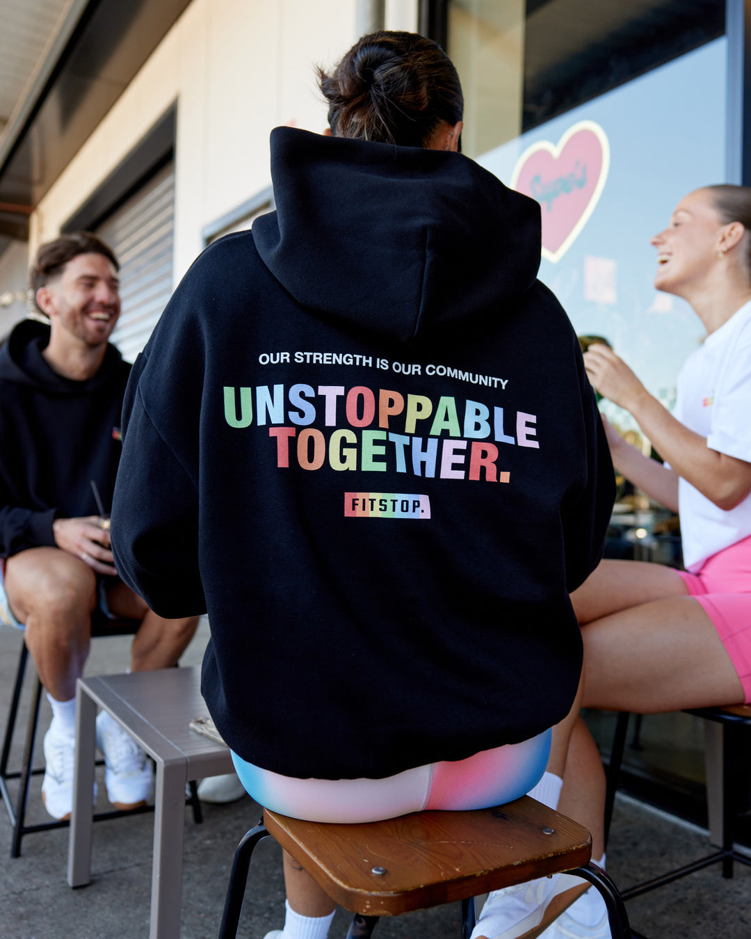 Woman wearing Fitstop Unstoppable Together Oversized Hoodie - Black | Model:Beccie | Size:S