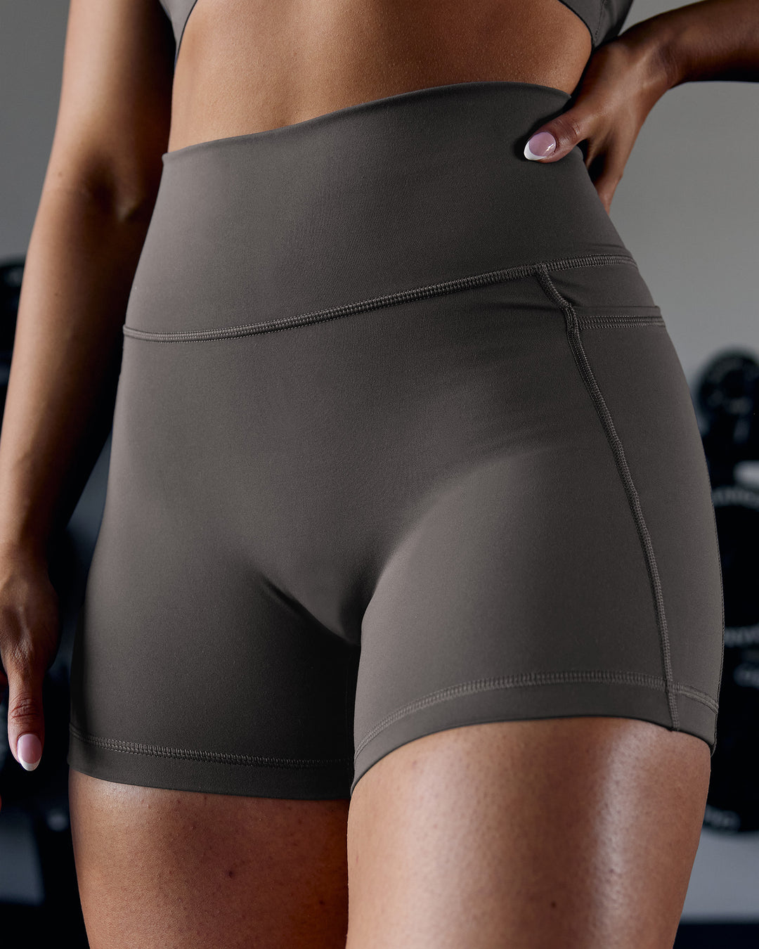 Woman wearing Fusion Ultra High-Rise 4" Short Pockets - Dark Storm | Model:Ayla | Size:S