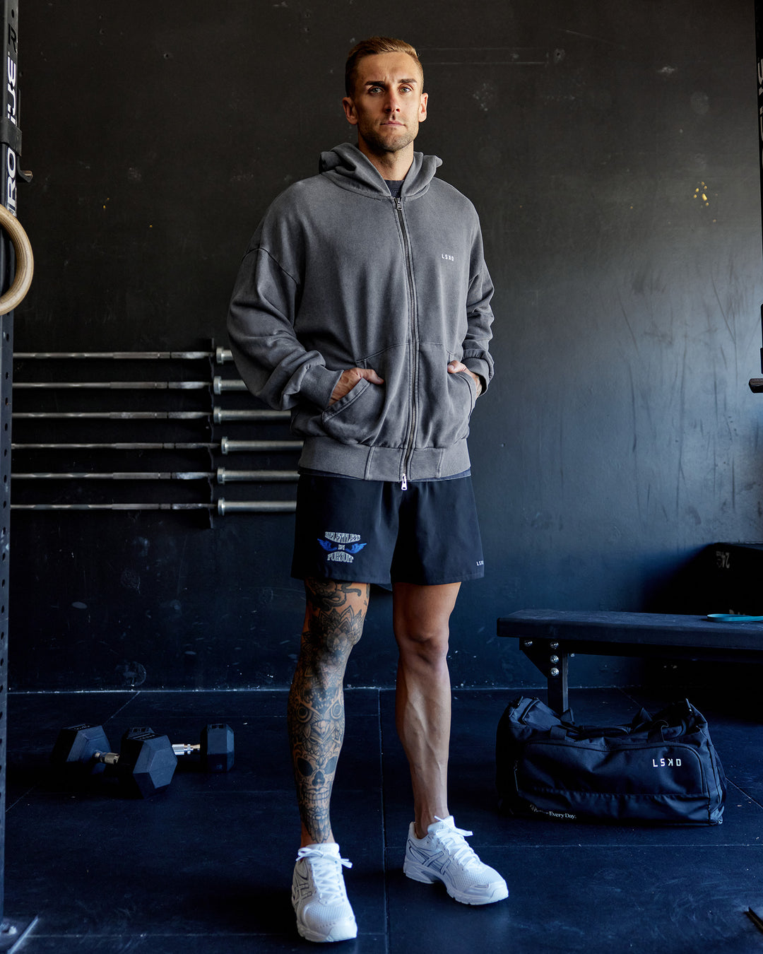 Man wearing Relentless Washed Zip Through Oversized Hoodie - Dark Storm-White | Model:Tommy | Size:S