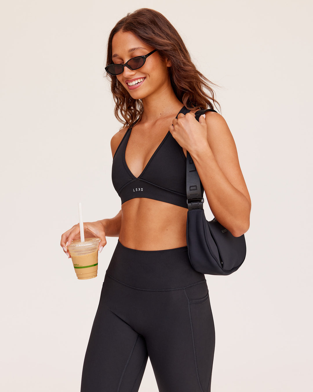 Woman wearing Stamina Sports Bra - Black | Model:Dakota | Size:S