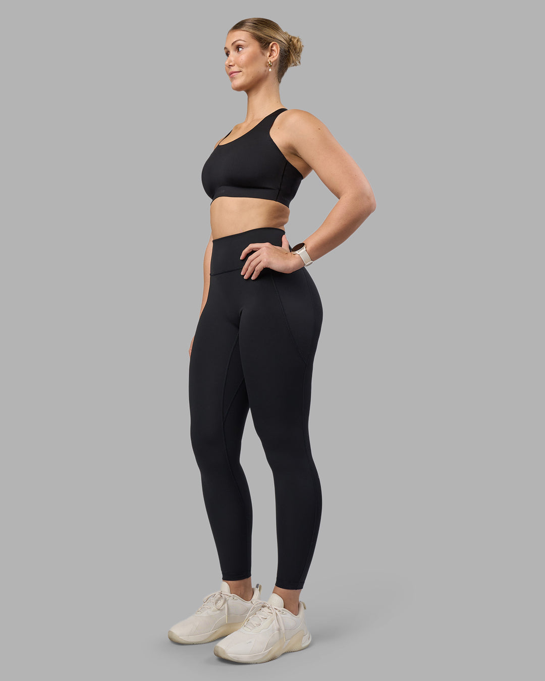 Woman wearing Stability Sports Bra - Black | Model:Amy | Size:S (D-E Cup)