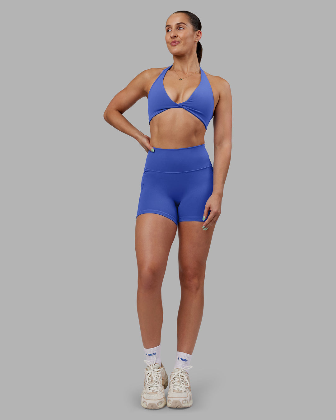 Woman wearing Abs Fusion High-Rise 4" Short Pockets - Power Cobalt | Model:Abbey | Size:S