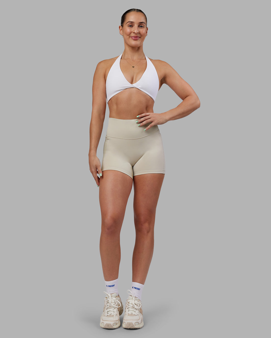 Woman wearing Abs Fusion High-Rise 4" Short Pockets - Shale Beige | Model:Abbey | Size:S