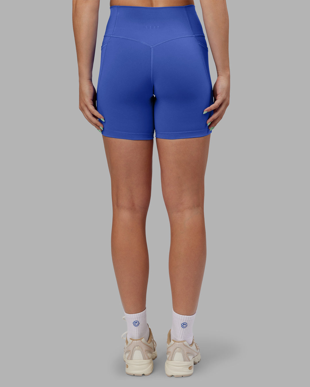 Woman wearing Abs Fusion High-Rise 6" Short Pockets - Power Cobalt | Model:Abbey | Size:S